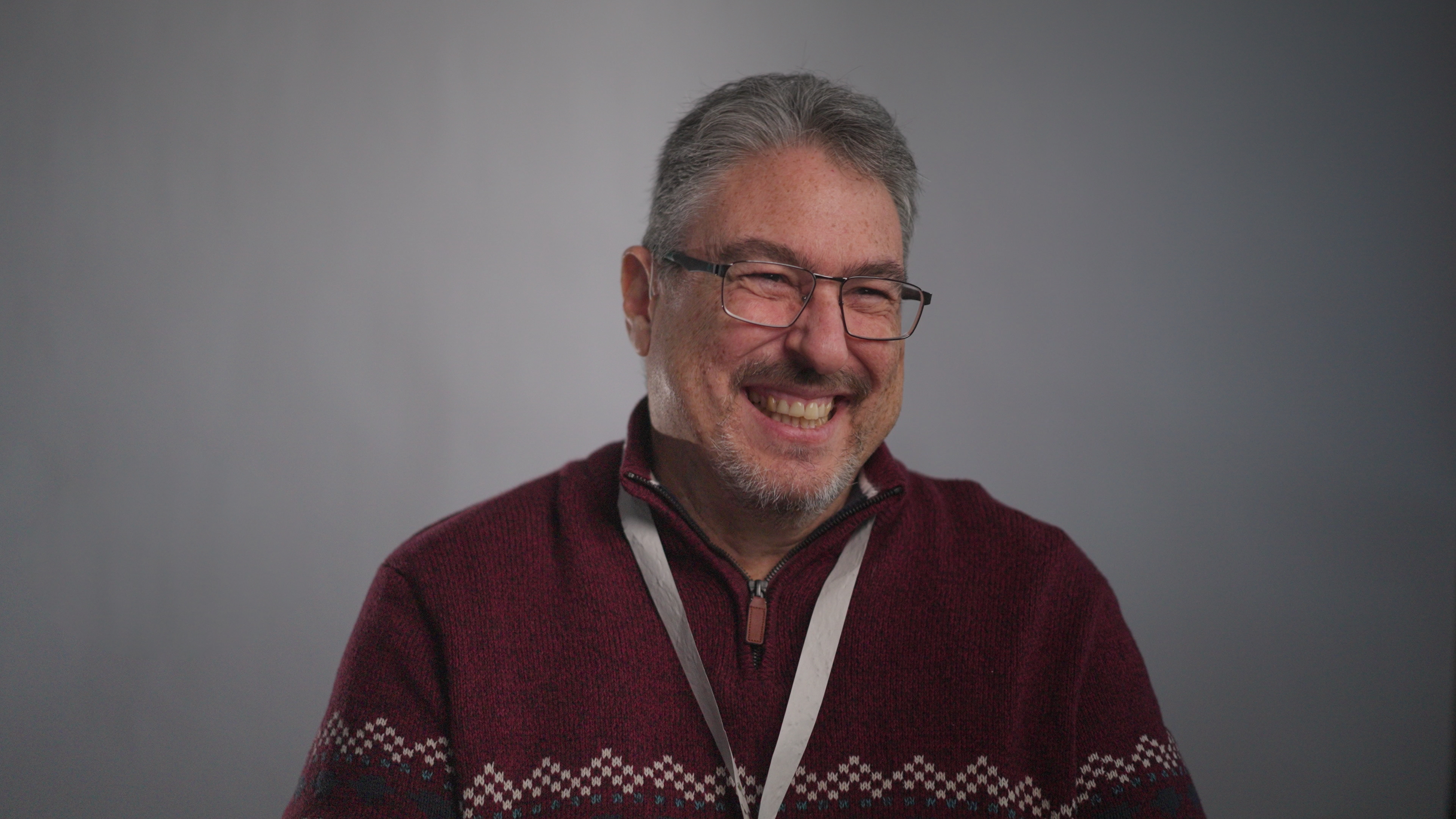A participant in conversation at a conference, from the FH Europe micro stories